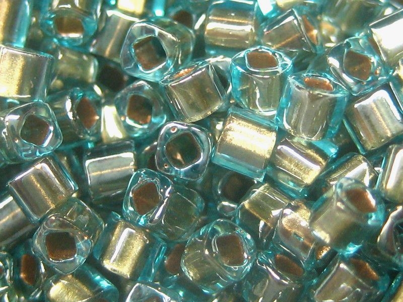 1,5mm 10g TOHO Würfel Cubes Gold Lined Aqua